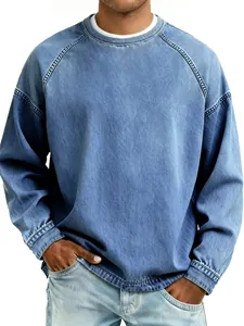 Detailed shot of men's vintage washed blue crewneck sweatshirt with raglan sleeves