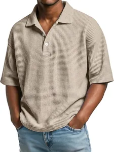 Close-up of khaki waffle-knit short-sleeve polo shirt with buttoned lapel detail