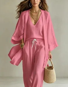 Detail of stylish pink cotton linen three-piece set with V-neck top and long cardigan
