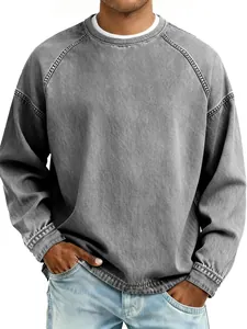 Detail of men's vintage washed gray crewneck sweatshirt featuring a loose casual fit style.