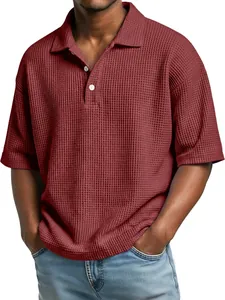Close-up detail of men's waffle knit short sleeve Polo shirt in burgundy red color