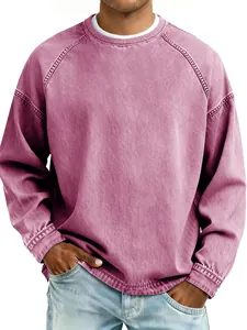 Macro view of men's vintage washed crew neck sweatshirt in casual dusty rose finish