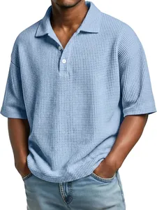 Close-up of light blue men's waffle knit polo shirt showing textured fabric detail