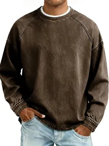 Detailed view of men's vintage washed brown crewneck sweatshirt featuring a relaxed fit