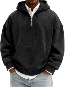 Detail of a men's black suede half-zip hoodie with front pocket and zipper detail.
