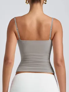 Back view of a grey camisole with adjustable spaghetti straps on a female model