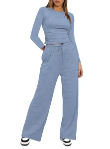 Close-up of blue two-piece lounge set featuring a ruched top and high-waisted wide-leg pants