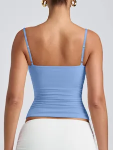 Back view of light blue camisole showing adjustable spaghetti straps and scoop back.