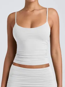 Close-up detail of white women's camisole with thin straps and low scoop neckline for summer