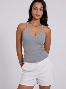 Close-up detail of gray ribbed V-neck sports tank top for women in studio light