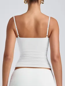 Detailed back view of a white women's camisole with adjustable spaghetti straps