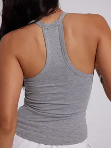 Detailed view of women's gray ribbed racerback tank top showing fabric texture