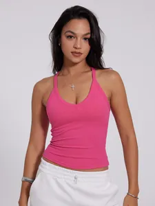 Fashionable pink V-neck ribbed halter sports tank top worn by model for fitness