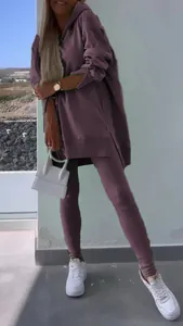 Women's purple two-piece set with oversized hoodie and matching leggings for casual sports.