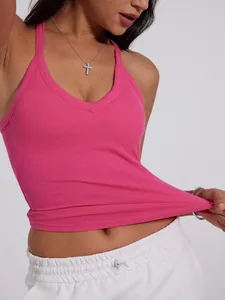 Close-up detail of hot pink ribbed V-neck sports tank top showing stretchy fabric texture