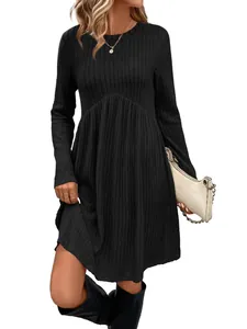 Detail view of black long sleeve ribbed knit dress with crew neck and high waist