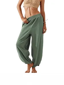High-waisted loose fit sage green harem pants with elastic waist and side pockets for women