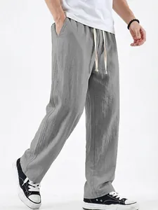 Detailed side view of men's grey linen casual straight leg pants with drawstring