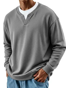 Close-up detail of grey men's sweatshirt featuring a stylish faux two-piece collar