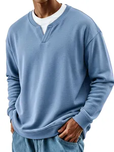 Macro view of men's mock two-piece sweatshirt featuring ribbed neckline and blue texture