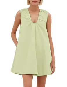 Detailed view of pale green sleeveless V-neck dress with shoulder pleats and wide straps