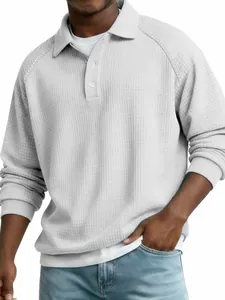 Close-up of men's waffle knit long sleeve polo shirt with button collar detail