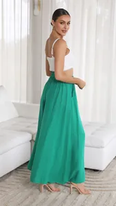 Detailed view of emerald green high-waisted wide-leg pants with elastic waist