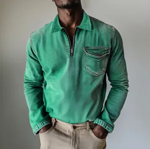 Close-up detail of a green long-sleeved denim shirt featuring a half-zipper and chest pocket