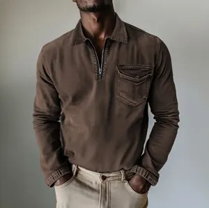 Detailed shot of brown half-zip denim shirt with polo collar and chest pocket