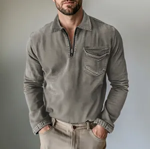 Close-up of men's half-zip denim shirt with lapel collar and utility chest pocket detail.