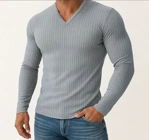 Close-up detail of a men's light blue long-sleeved T-shirt with ribbed texture and V-neck