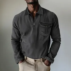 Detail view of men's charcoal grey half-zipper denim shirt with chest pocket