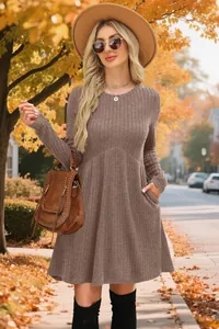 Detailed view of an autumn brown ribbed long-sleeved dress with a high waist and pockets.