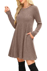 Detail view of a brown long-sleeved ribbed mini dress with pockets and a round neck design.