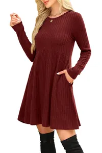 Detail of burgundy ribbed knit dress showing texture, high waist, and side pocket