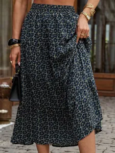 Detailed macro view of navy blue floral tiered maxi skirt with vintage pleats