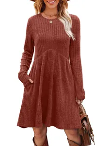Long sleeve crew neck high waist ribbed knit dress with pockets in solid brick red