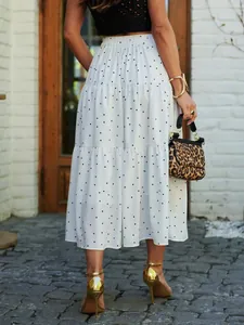 Back detail of white tiered polka dot maxi skirt with elastic high waist band