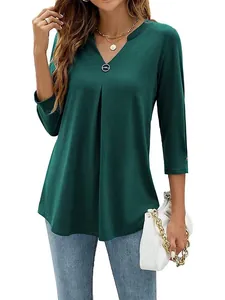 Elegant dark green 3/4 sleeve V-neck tunic with pleated front and decorative button detail
