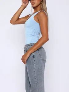 Side profile detail of a light blue slim-fit athletic tank top paired with denim jeans