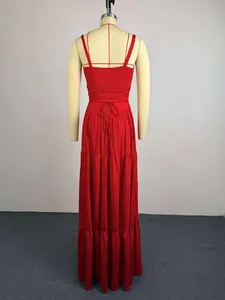 Detailed back view of a red tiered maxi dress featuring thin straps and a lace-up waist design