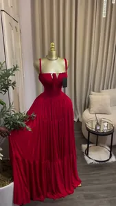 Detailed view of an elegant red pleated high-waist maxi camisole formal evening dress