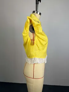 Detailed side view of yellow striped shirt with beaded collar and white lace trim hemline