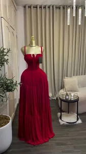 Detail view of a red tiered maxi dress with thin straps and a sweetheart neckline