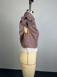 Side view detail of a striped short sleeve shirt with beadwork and eyelet lace trim