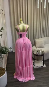 Elegant pink pleated high-waist camisole evening dress shown from the back on mannequin.