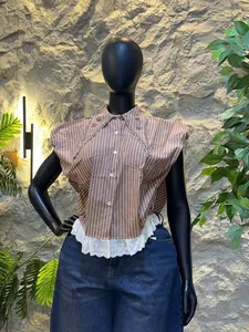 Detailed visual of a striped fashion shirt with beaded collar and white lace hem