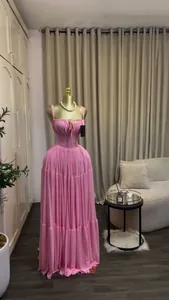 Elegant pink high-waist pleated maxi dress with straps presented on a mannequin