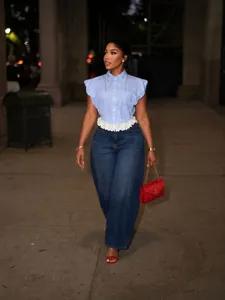Chic striped short sleeve shirt with ruffle hem and bead details styled for a night out