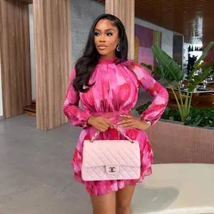 Elegant pink floral print mini dress with long sleeves and pleated waist for summer 2026